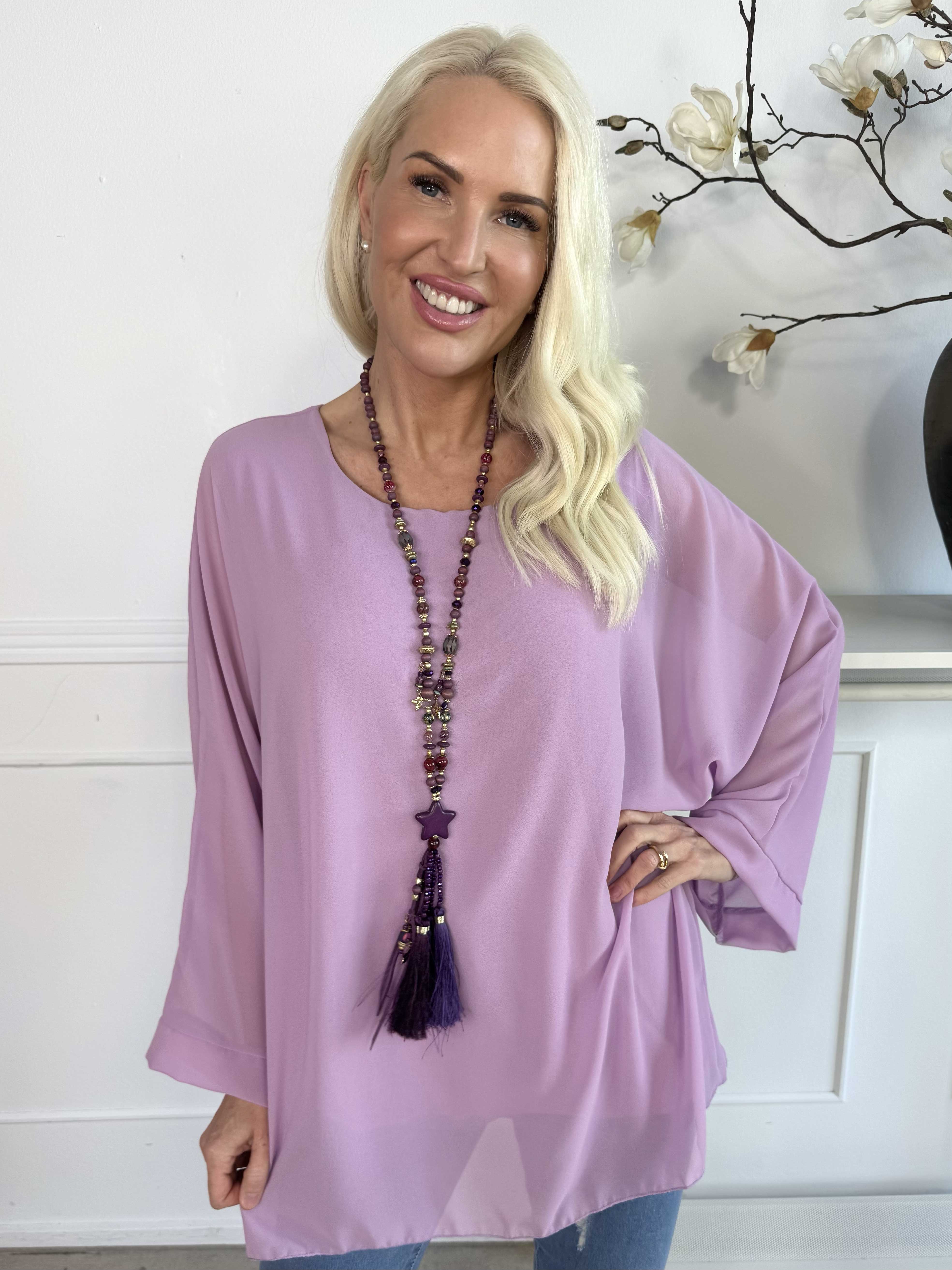 Flores - Tunika med chiffonglager och halvgenomskinliga ärmar